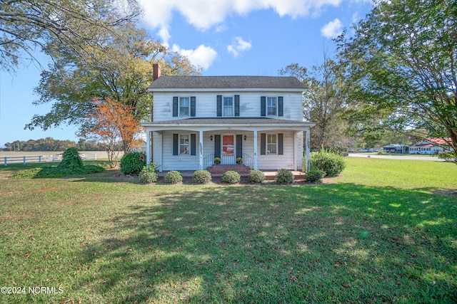 view of front facade with a porch and a front lawn