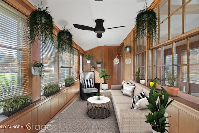 sunroom / solarium with ceiling fan, lofted ceiling, and plenty of natural light