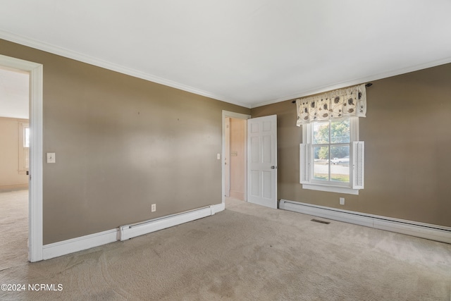 carpeted empty room with crown molding and a baseboard heating unit