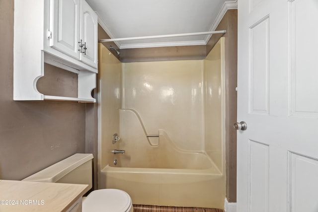 full bathroom featuring vanity, toilet, ornamental molding, and bathing tub / shower combination