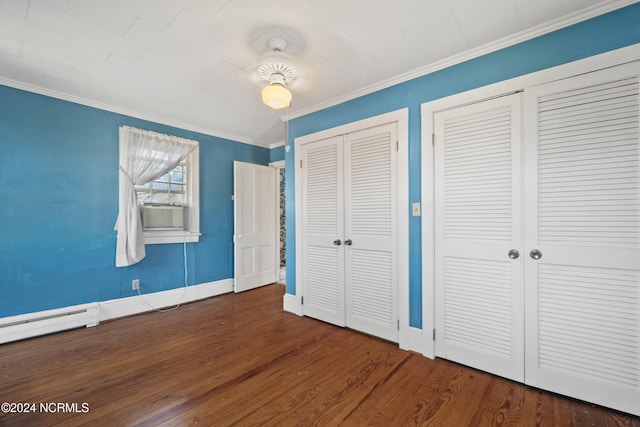 unfurnished bedroom featuring ceiling fan, cooling unit, multiple closets, dark hardwood / wood-style floors, and crown molding