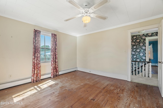 spare room with crown molding, hardwood / wood-style floors, a baseboard radiator, and ceiling fan