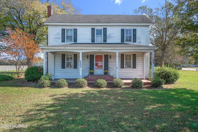 view of front of house featuring a porch and a front lawn