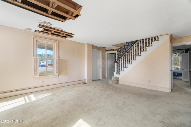 interior space featuring baseboard heating and carpet