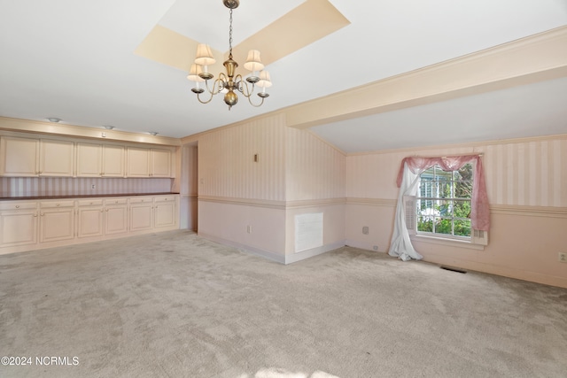 empty room with light carpet and an inviting chandelier