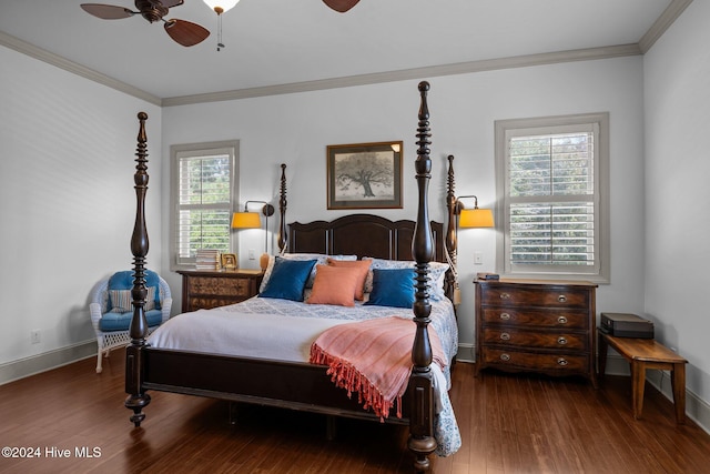 bedroom featuring ornamental molding, ceiling fan, dark hardwood / wood-style flooring, and multiple windows