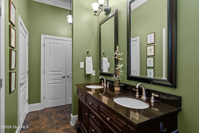 bathroom with ornamental molding and vanity