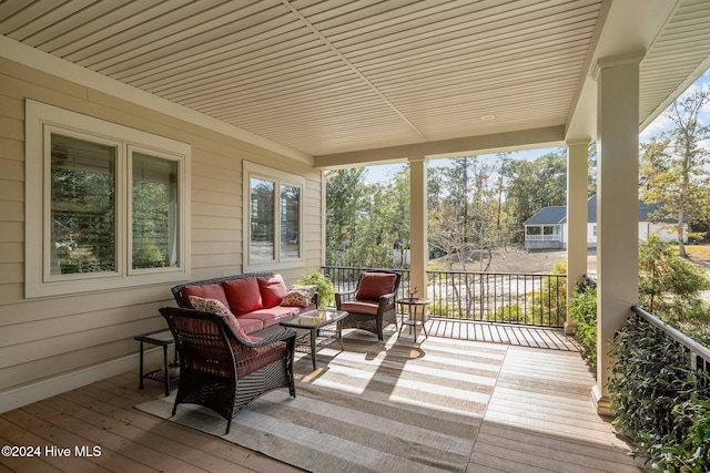 wooden deck with outdoor lounge area