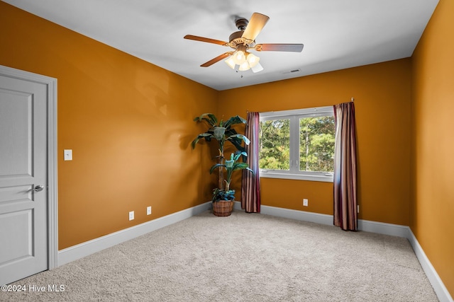 carpeted empty room with ceiling fan