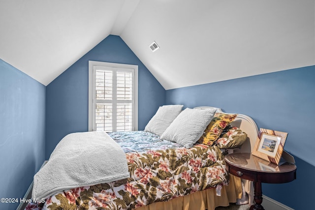 bedroom with lofted ceiling