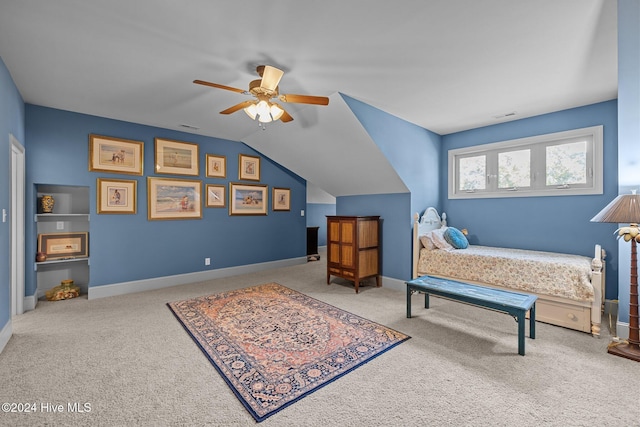 bedroom with lofted ceiling, ceiling fan, and carpet