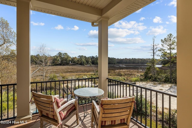 balcony featuring a rural view