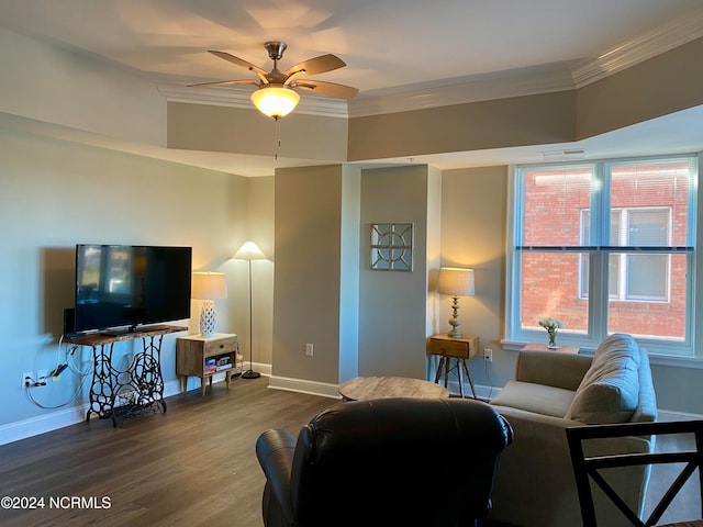 living room featuring wood-type flooring, ceiling fan, and ornamental molding