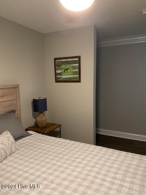 bedroom featuring crown molding