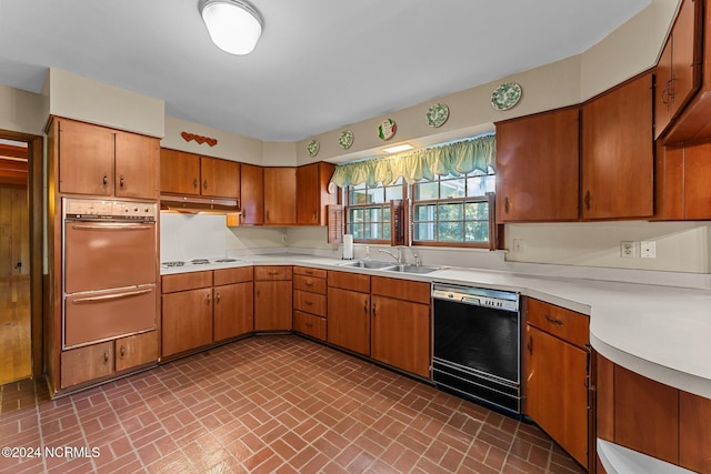 kitchen with dishwasher, oven, a sink, a warming drawer, and under cabinet range hood