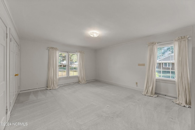 carpeted spare room with ornamental molding