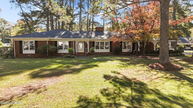 ranch-style home featuring a front yard