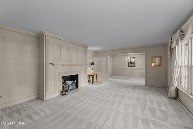 unfurnished living room featuring light colored carpet, ornamental molding, a chandelier, a premium fireplace, and baseboards