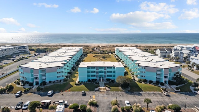 aerial view featuring a view of the beach and a water view