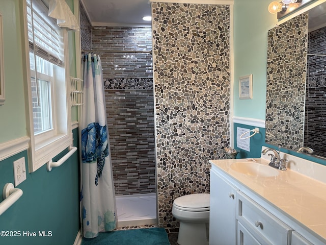 3307 Ocean Dr Unit 2, Emerald Isle, NC 28594 - bathroom with toilet, vanity, a shower stall, and a wainscoted wall