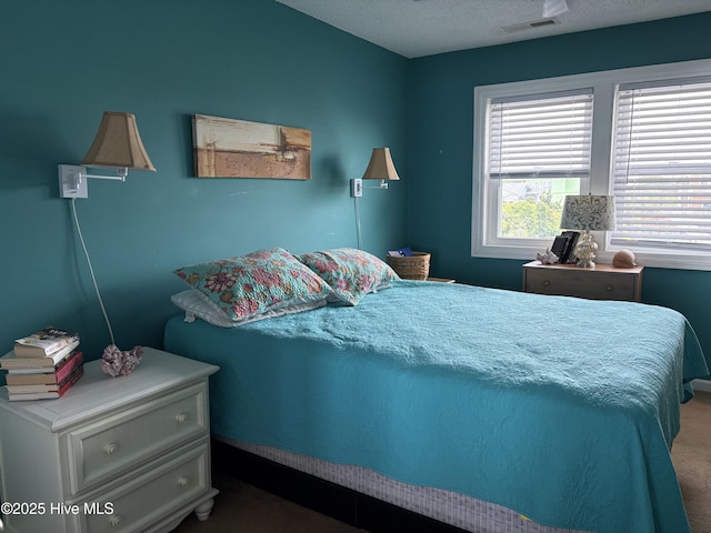 3307 Ocean Dr Unit 2, Emerald Isle, NC 28594 - carpeted bedroom with a textured ceiling