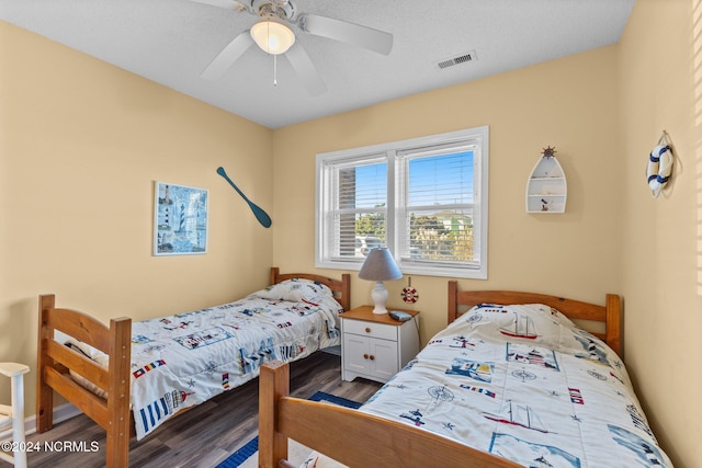 bedroom with hardwood / wood-style floors and ceiling fan