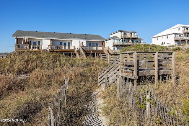 3307 Ocean Dr Unit 2, Emerald Isle, NC 28594 - back of property featuring a wooden deck and stairway