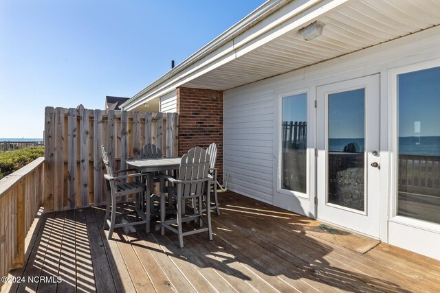 wooden deck featuring outdoor dining space