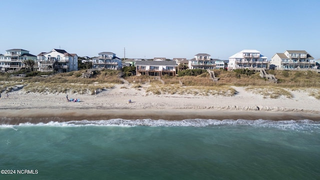 bird's eye view with a view of the beach and a water view