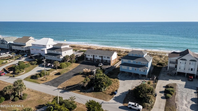 aerial view with a water view and a view of the beach