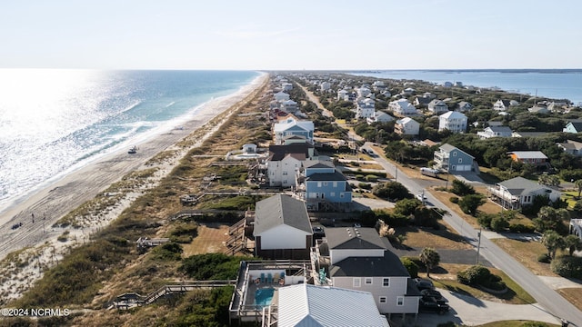 aerial view of residential area with unending shoreline