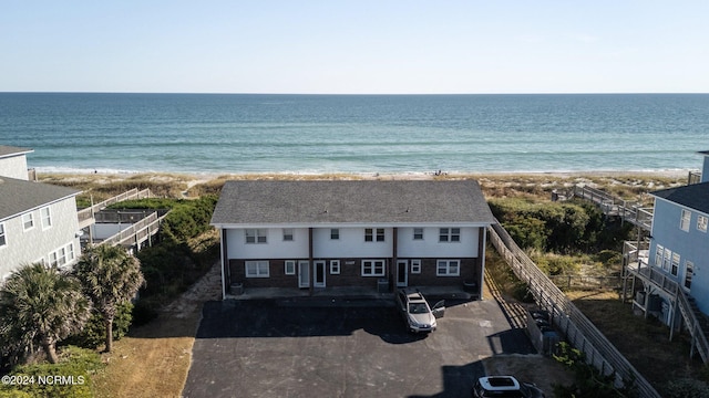 view from above of property featuring waterfront with a beach