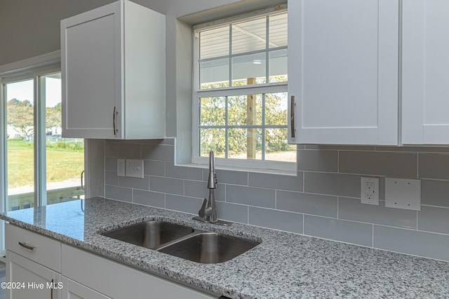 kitchen featuring white cabinetry, a wealth of natural light, wood-type flooring, and appliances with stainless steel finishes