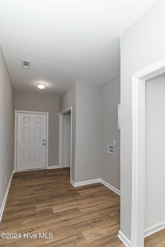 corridor featuring dark hardwood / wood-style flooring