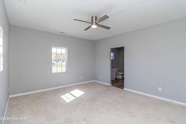 empty room featuring carpet flooring and ceiling fan