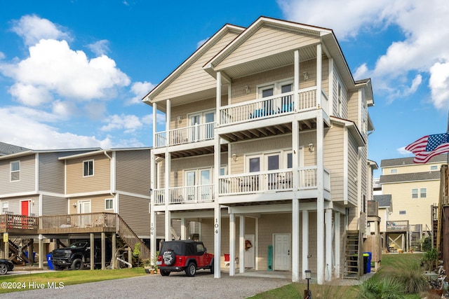 rear view of property featuring a balcony