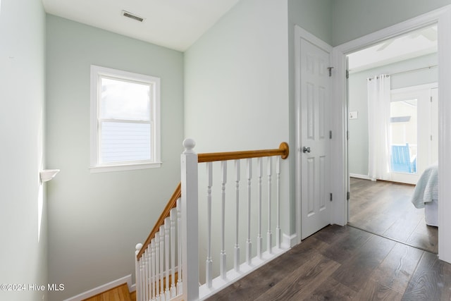 hallway with dark hardwood / wood-style floors