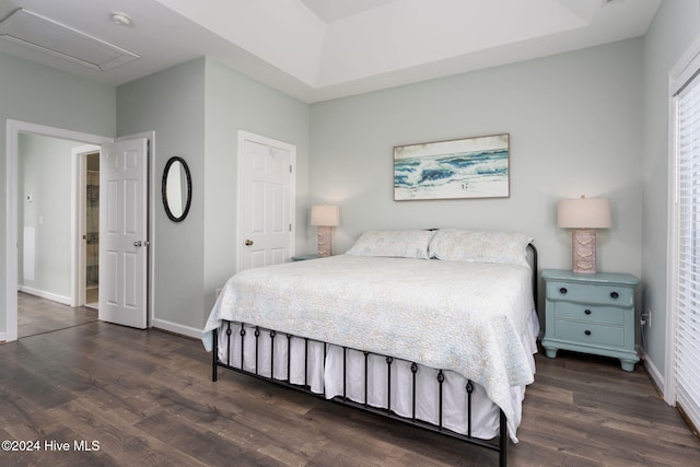 bedroom with dark wood-type flooring