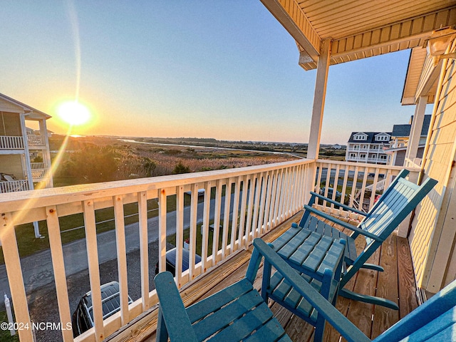 view of balcony at dusk