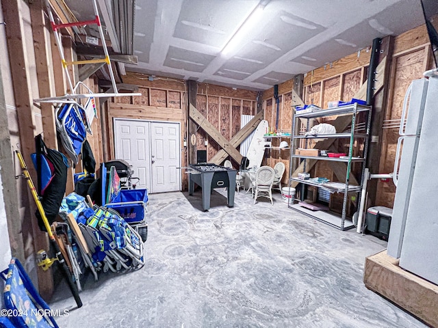 basement with white fridge