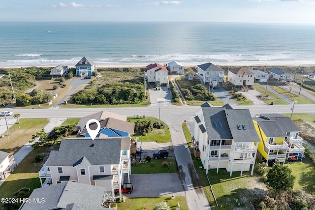 bird's eye view featuring a beach view and a water view