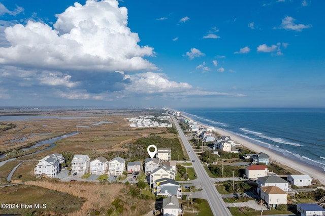 aerial view with a water view and a view of the beach