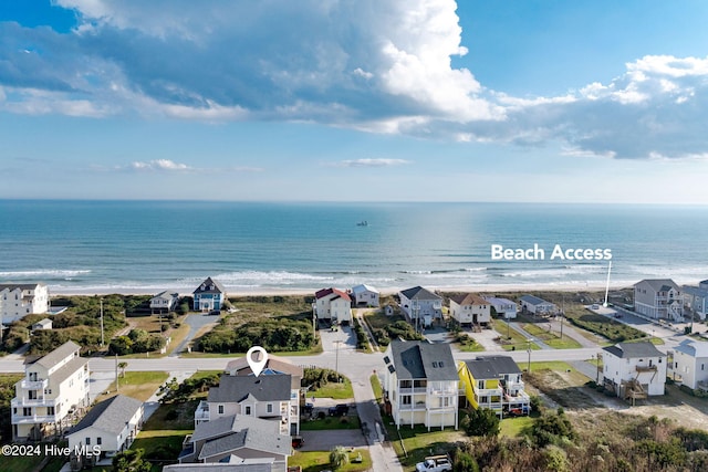 bird's eye view with a view of the beach and a water view