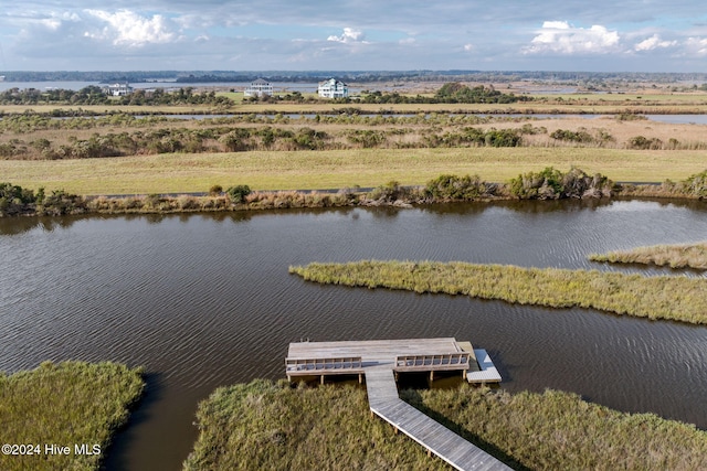 aerial view with a rural view and a water view