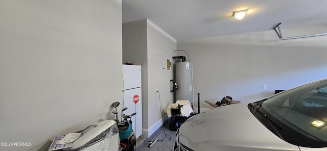 garage featuring water heater and white fridge