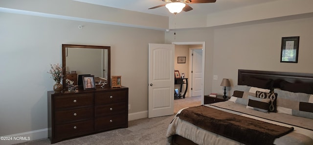 bedroom with light colored carpet and ceiling fan