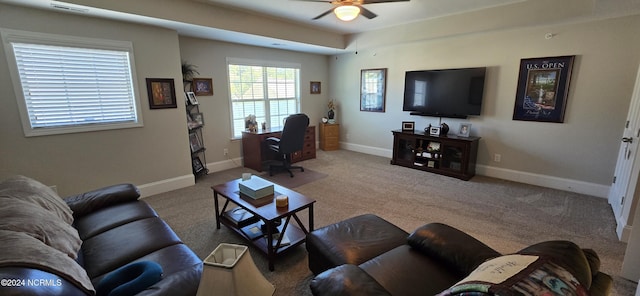 carpeted living room featuring ceiling fan