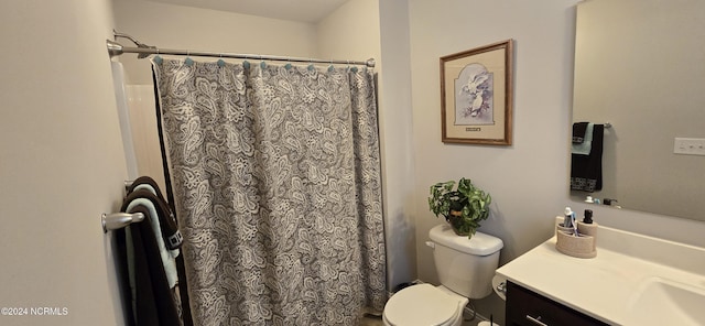 bathroom with vanity, a shower with curtain, and toilet