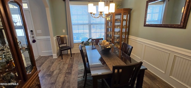 dining space featuring an inviting chandelier and dark hardwood / wood-style floors