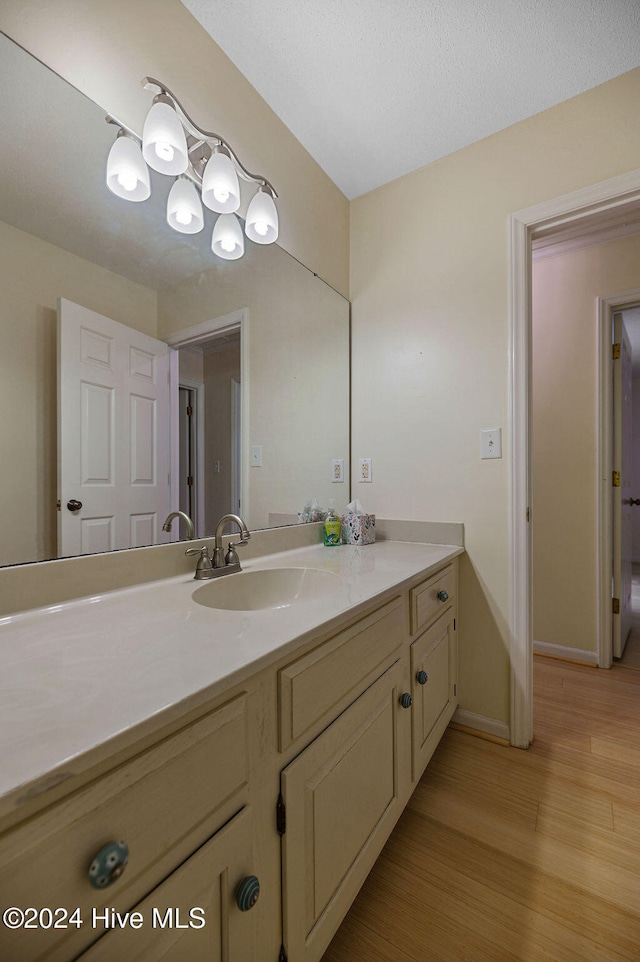 bathroom featuring vanity and hardwood / wood-style floors